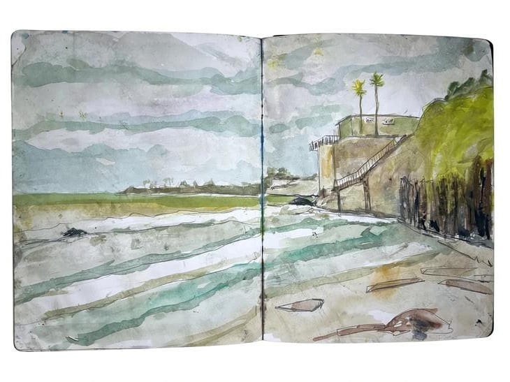 Watercolor sketchbook spread showing coastal landscape with pier, beach, palm trees, and calm waters in muted green and blue tones